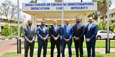 DCI boss Amin Mohamed (fourth from left ) poses for a photo with officials from the Federal Bureau of Investigations (FBI) on Thursday, November 10, 2022