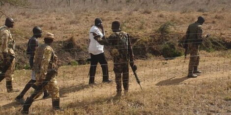 DCI officials and KWS rangers arrest a suspect inside the Nairobi National Park Wednesday, November 9, 2022