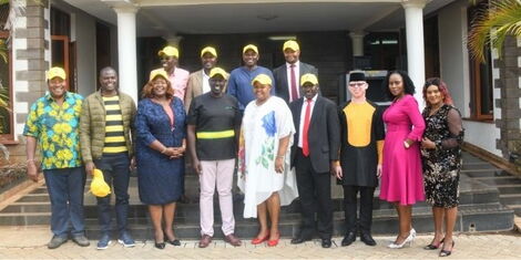 DP Ruto and a members of UDA pose for a photo outside his office in Karen on January 17, 2022.
