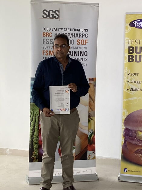 DPL Festive Boss Jaynish Shah holding the Food Safety System Certification 22000 (FSSC 22000) certificate on Tuesday, April 13, 2021