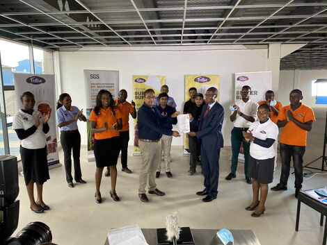 DPL Festive Boss Jaynish Shah receives the Food Safety System Certification 22000 (FSSC 22000) certificate on Tuesday, April 13, 2021 as staffers look on.