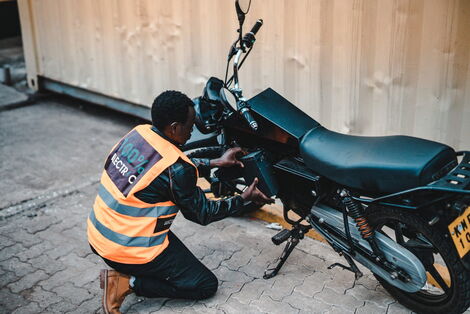 A rider handling an electric motorcycle launched by Opibus company.