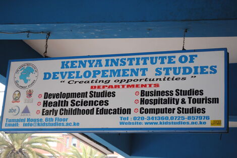 A signboard showing various departments at the Kenya Institute of Development Studies. 