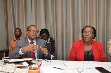 Engineer Mike Mutungi together with the Ministry of Education Deputy Director of Policy, Emis Njeru at a meeting on January 24, 2018,