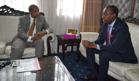 Foreign Affairs PS Macharia Kamau with Rwanda's High Commissioner to Kenya James Kimonyo in 2018