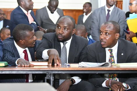 From left: Lawyer dan Maanzo, Kipchumba Murkomen, and Mutula Kilonzo Jr. deliberate during a court appearance.