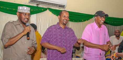 Defence CS Aden Duale (right) and Garissa Township MP-elect Mohamed Barrow Dekow (centre), speaking to the audience in the constituency on Monday, January 2, 2023. 