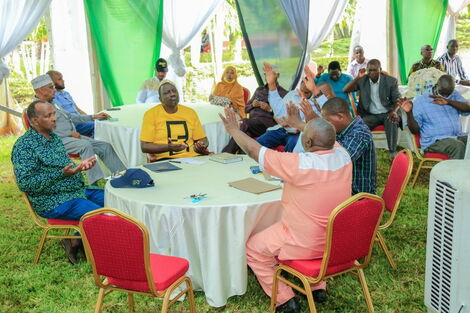 Deputy President William Ruto (in yellow Tshirt) and MP Aden Duale attend a clergy meeting in Garissa on Wednesday, December 22, 2021.