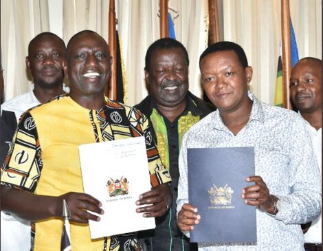 Deputy President William Ruto (left) accepts MCC leader Alfred Mutua into Kenya Kwanza on Monday, May 9, 2022.