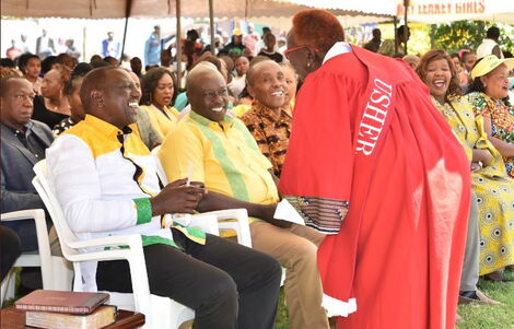 Deputy President William Ruto (left) and his running mate Rigathi Gachagua being ushered to ACK St Paul's Mother Church in Kabete