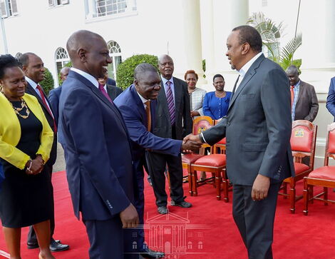 Deputy President William Ruto (second from left) and President Uhuru Kenyatta pictured during the meeting with the sugarcane industry stakeholders at State House Nairobi on February 24.