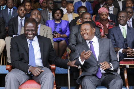 Deputy President William Ruto and Machakos Governor Alfred Mutua share a light moment