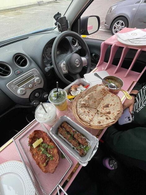 File photo of a motorist enjoying a meal inside a car