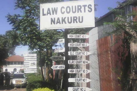 Directional signage outside the Nakuru Law Courts.