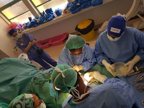 Doctors attending to a patient