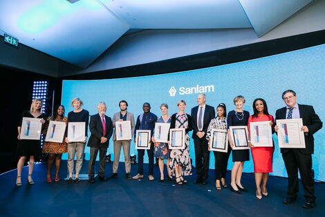 Donald Magomere (sixth from left), a reporter at Financial Times, poses with his award at Sanlam Award Gala in South Africa on Friday, November 13, 2020.
