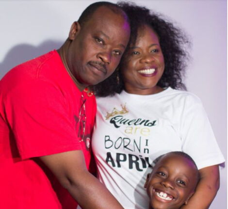 Dr Catherine Nyongesa, her husband and child pose for a photo during her 50th birthday in 2019