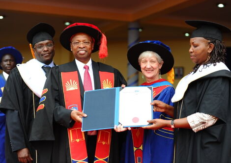 Dr. Njoroge, second from left, receives honorary doctorate from Mount Kenya University in 2014. 