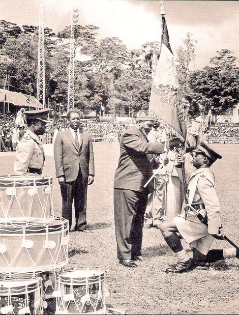 The presentation of Presidential Colour to 1 Battalion, the Kenya Rifles, by former President Jomo Kenyatta on 12th December 1964.