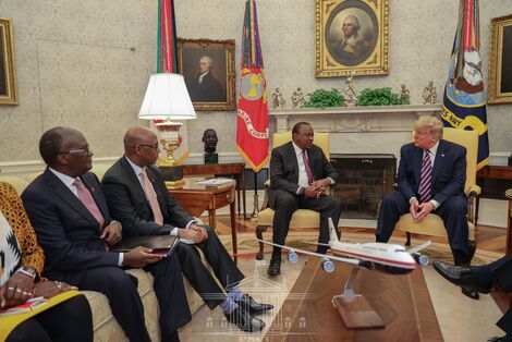 From left, Transport CS James Macharia, EAC CS Adan Mohamed, President Uhuru Kenyatta and US president Donald Trump during a meeting in the United States on February 6, 2020.