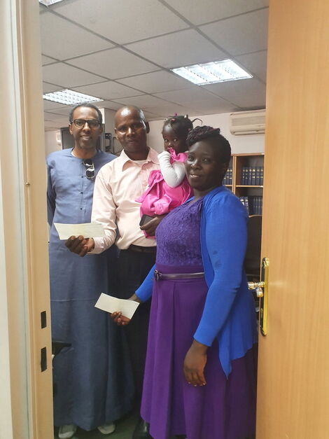 From Left: Constitutional lawyer Ahmednasir Abdullahi, a watchman Alfayo Omwenga, his wife and two children at the lawyer's office on Friday, February 21.