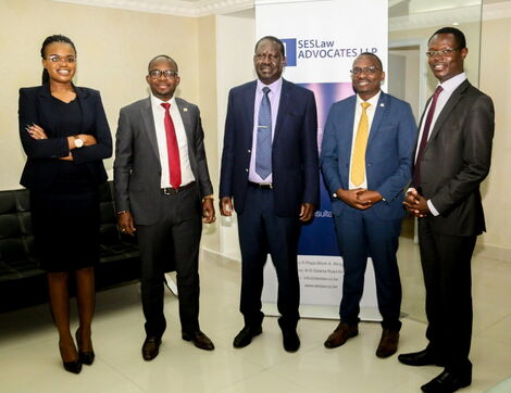 Azimio la Umoja Presidential flagbearer, Raila Odinga (centre), poses for a photo alongside lawyers from SES Law Advocates LLP in June 2020. 