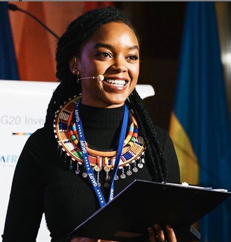DW reporter Edith Kimani speaking at the CWA investment Summit in December 2018.