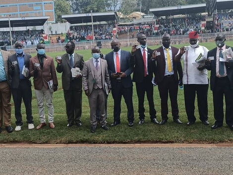 Some of the 10 recipients of Huduma Card displays them during Mashujaa Day Celebrations in Kisii on Tuesday, October 20, 2020.