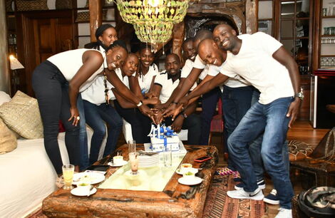 Elegeyo Marakwet Senator Kipchumba Murkomen (centre) cuts his birthday cake alongside family and friends on March 12, 2020.