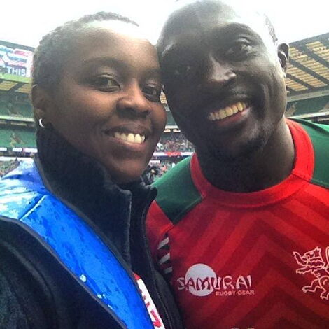 Elsie Kibue posing for a photo with Kenya Sevens player Collins Injera.