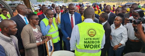 Employees in the Nairobi County government present a painting to Governor Johnson Sakaja on February 2, 2023