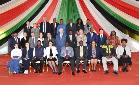 European Union Ambassador to Kenya, Henriette Geiger and President William Ruto pose for a photo with other diplomats 