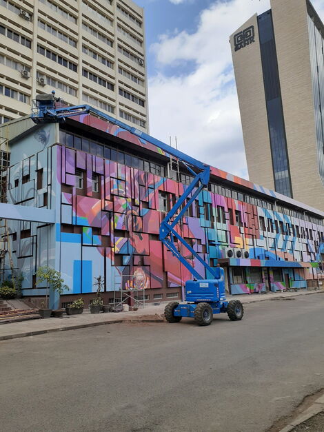 Murals on the side of the ExTelecoms building located along Haille Selassie Avenue