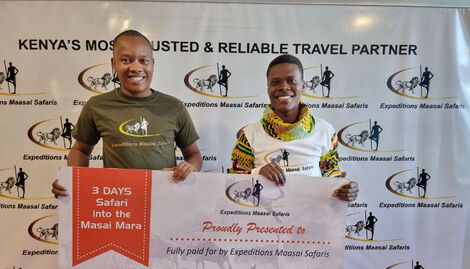 Expedition Maasai Safaris CEO Pancras Karema (left) presents a reward to KBC journalist Alvin Kaunda on Saturday, November 19, 2022.