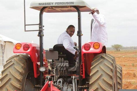 President Uhuru Kenyatta irrigating the Galana Kulalu project