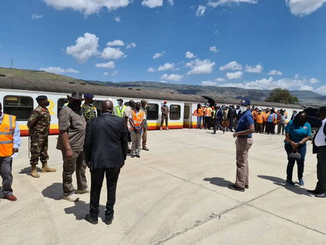 President Uhuru Kenyatta together with General Muhoozi Kainerugaba (in blue polo shirt) inspecting the Inland Container Depot in Nakuru County on January 13, 2022.