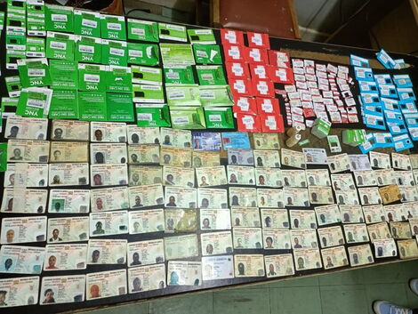SIM cards and ID cards recovered from the suspects' hideout in Uthiru, Kiambu County on January 28, 2022.