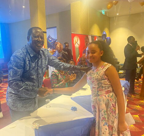 Former Prime Minister engaging with Natasha Macharia during an engagement forum in the UK on March 17, 2022.