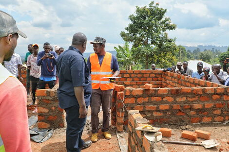 Interior Cabinet Secretary Fred Matiang'i inspecting a house being constructed for Mzee Joseph Abuga Oribo in Kisii County.