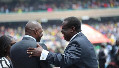President William Ruto aide Farouk Kibet sharing a light moment with ANC party leader Musalia Mudavadi at Kasarani Stadium on Tuesday, September 13, 2022