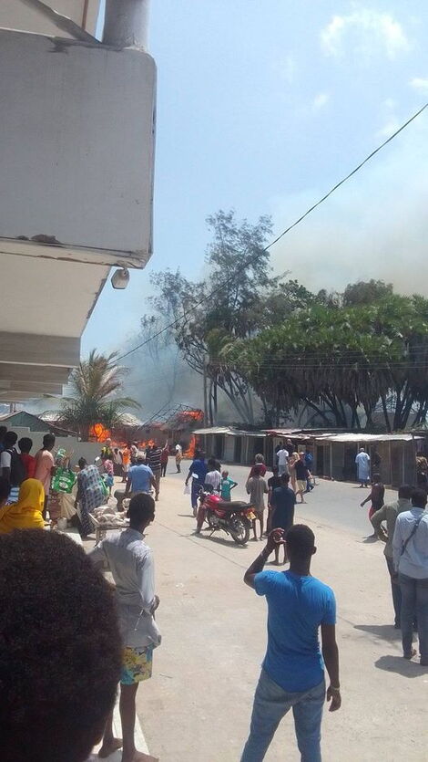 Residents watching as fire razes down hotels and businesses in Watamu, Kilifi County on Wednesday February 22, 2023