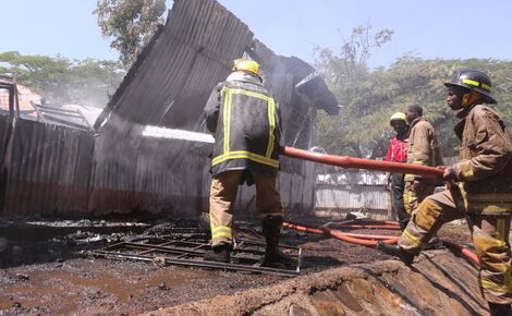 Firefighters putting out dormitory fire at Kisumu Boys High School on January 26, 2021