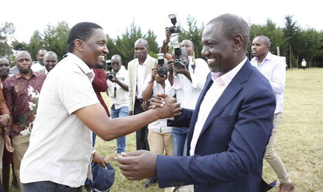 Former Agriculture CS Mwangi Kiunjuri (l) enjoy a hearty moment at Thiru Secondary School, Laikipia West, Laikipia County on February 22, 2020.