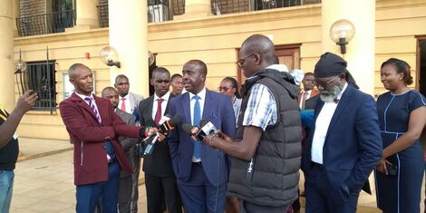 Former CS Fred Matiang'i's lawyers led by Danstan Omari address the press outside Milimani Courts on Thursday, February 9, 2023