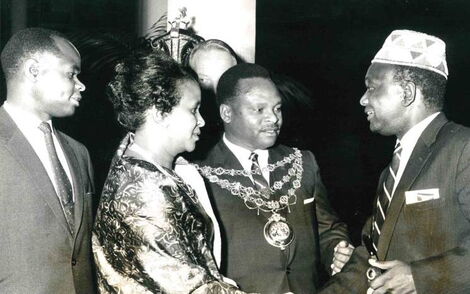 Former Nairobi Mayor Charles Rubia, his wife, and Deputy Mayor Isaac Lugonzo greeting Ronald Ngala at City Hall in Decemeber 1964.