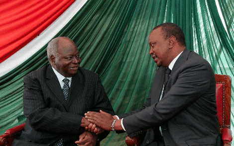 Former President Mwai Kibaki greets his successor Uhuru Kenyatta.