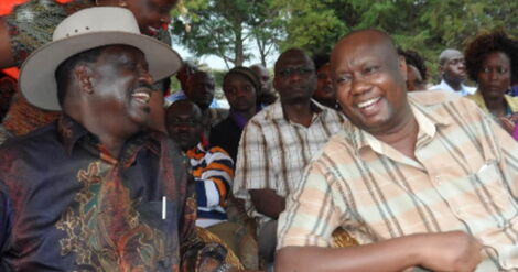 Former Prime Minister Raila Odinga (left) and Busia Governor Sospeter Ojaamong