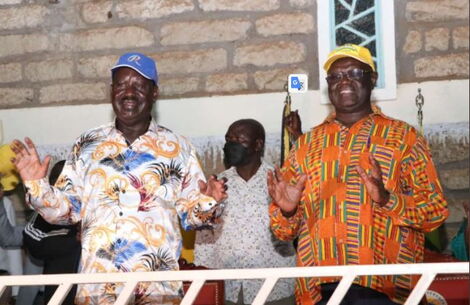 Former Prime Minister Raila Odinga (left) and Meru Governor Kiraitu Murungi.