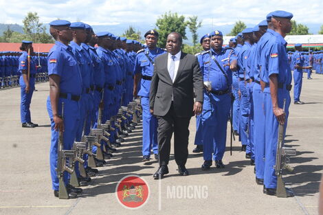 Interior Cabinet Secretary Fred Matiang'i inspects a guard of honour during a passing out parade for 1,224 officers in December 2019