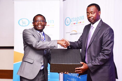 Octagon Africa Group CEO Fred Waswa (left) and Retirements Benefits Authority CEO Nzomo Mutuku (right) during the announcement launch of the strategic business partnership signed between Octagon Africa and Alexander Forbes.